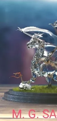 This beautiful live wallpaper features an intricately detailed digital art of a dragon statue made of glass, with a miniature silver statue of Sleipnir on the table and other mythical creatures surrounding it