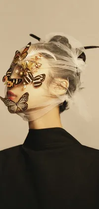 This phone live wallpaper showcases a captivating image of a woman wearing a butterfly mask on her face