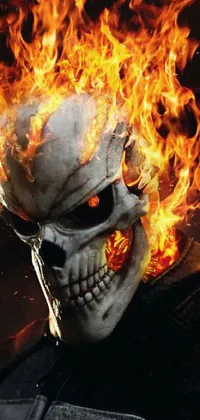 This phone live wallpaper features a fiery close-up of a mask with swirling smoke and flames