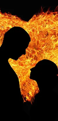 This phone live wallpaper depicts a romantic scene of a man and woman in front of a flaming heart
