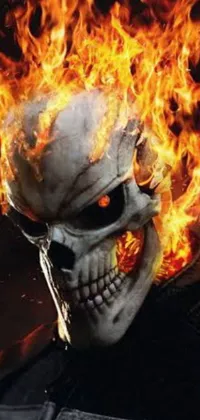 This phone live wallpaper features a realistic skull on fire with flames on its face, giving off an intense action-movie-like vibe