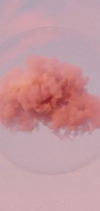 This phone live wallpaper showcases a stunning pink cloud floating in a serene blue sky with mesmerizing smoke grenades and soft orange mist for a unique effect