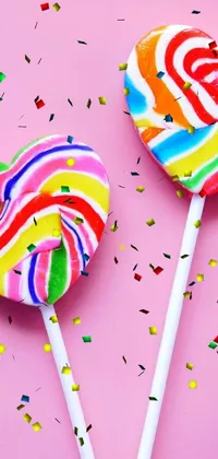 Looking for a cheerful and playful live wallpaper for your phone? This two-lollipop design, featuring bold colors and dynamic lines reminiscent of process art, is sure to brighten up your device