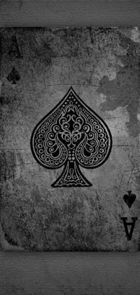 The black and white phone live wallpaper features an intricately detailed Ace of Spades playing card with a stipple effect