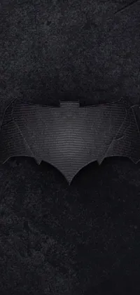 Get the ultimate Dark Knight experience with a highly-detailed Batman logo live wallpaper for your phone