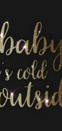 Looking for a stunning live wallpaper for your phone? Check out this amazing design! Featuring the phrase "baby it's cold outside" in an elegant goldsrc font, this wallpaper is set on a sleek black background that glows from the outside