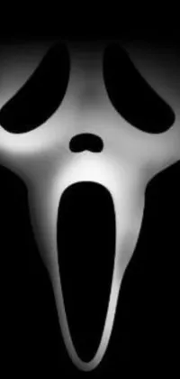 Get ready to spook up your phone's home screen with this chilling ghost face live wallpaper! The high-definition image features a close-up of a ghost's face against a dark black background, perfect for anyone who loves spooky and eerie elements