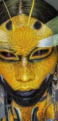 This sci-fi live wallpaper for phones showcases a close-up of a painted face, resembling an elegant insect with a realistic yellow skin
