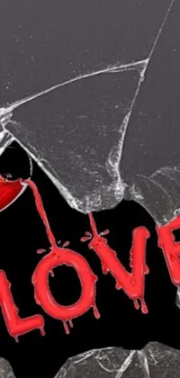 This striking phone live wallpaper features a broken glass with the word "love" etched upon it, set against a backdrop of bullet holes and blood splatter