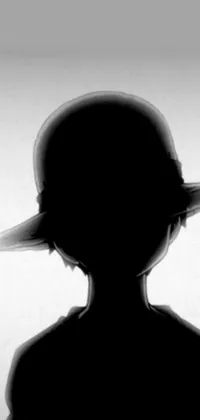 This phone live wallpaper showcases a stunning silhouette of a person wearing a hat