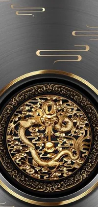 This stunning phone wallpaper depicts a detailed and beautifully designed gold plate featuring a lifelike dragon with intricate detailing