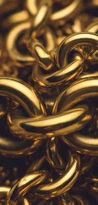 Enhance the visual appeal of your phone screen with this stunning live wallpaper featuring a close-up of a group of gold chains