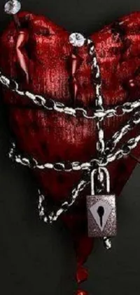 This gothic-inspired live wallpaper features a heart with chains and a lock, surrounded by thorns