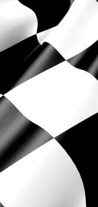Get your phone racing with this black and white checkered flag live wallpaper! Featuring a digital rendering of a waving flag, this high resolution (4k) wallpaper captures every detail of the iconic victory lap symbol
