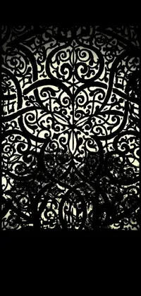 Get an elegant phone wallpaper featuring a black and white photo of a decorative screen with an abstract drawing heavily inspired by gothic art