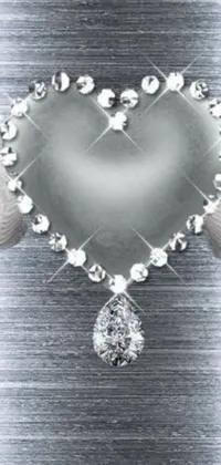 This lovely phone live wallpaper features a heart-shaped diamond surrounded by intricate angel wings