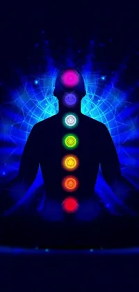This phone live wallpaper depicts a man in a lotus position with glowing chakras