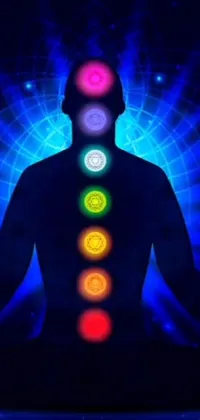 This live wallpaper features a serene man meditating in a lotus position, surrounded by the seven chakras and swirling rainbow spirals for eyes