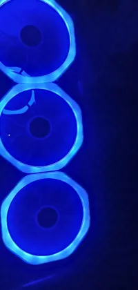 This live phone wallpaper shows a close-up shot of a computer case with blue lights
