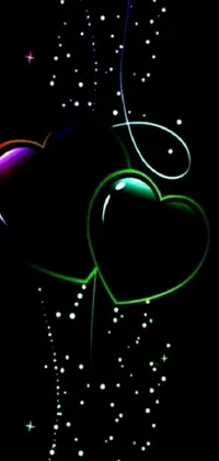 This vibrant phone live wallpaper depicts a pair of heart-shaped balloons floating in the darkness