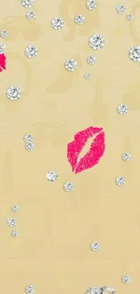 This phone live wallpaper features a bold vector art design by Florianne Becker of a cell phone with lipstick marks, emphasized by crystals and diamonds