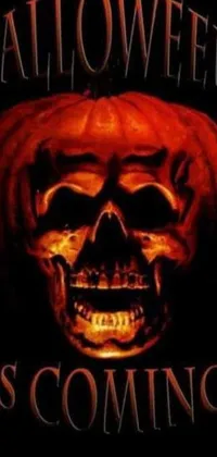 Get into the Halloween spirit with this live wallpaper for your phone! Inspired by classic horror film poster designs, this wallpaper features a flaming skull set against a dark background with the ominous tagline, "this is it