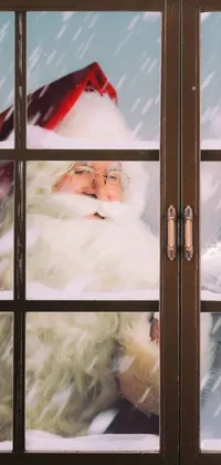 Get into the holiday spirit with this unique phone live wallpaper featuring a close-up of a window with a Santa Claus figure