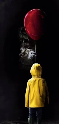 This live wallpaper for your phone features a hyperrealistic image of a yellow jacketed figure holding a red balloon against a black background