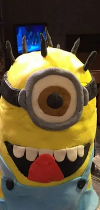 This phone live wallpaper features a delightful cake designed to look like a Minion character