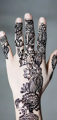 This gorgeous live phone wallpaper showcases a detailed henna design on a person's hand