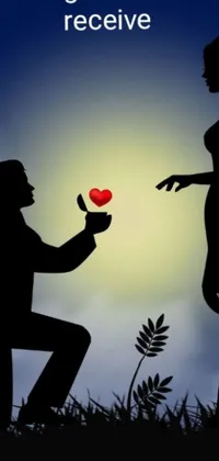 This live wallpaper features a touching silhouette of a man proposing to his girlfriend while holding up a red heart