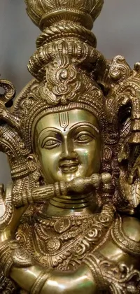 This phone live wallpaper showcases a stunning 3D rendering of a highly detailed brass statue