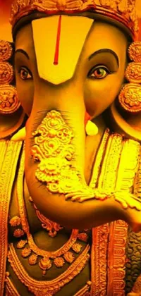 This phone live wallpaper features a stunning close-up of a highly detailed elephant statue, set against a warm yellow background