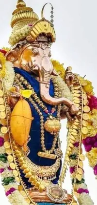 Elevate the beauty of your phone's screen with a mesmerizing live wallpaper featuring an intricate floral elephant statue