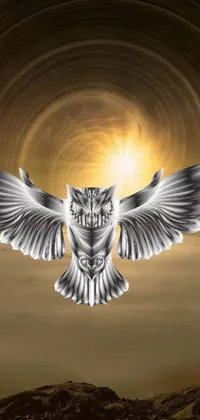 This phone live wallpaper features a graceful owl taking flight against a silver insignia