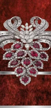 Bring a touch of opulence and class to your phone with this diamond and ruby broochle live wallpaper
