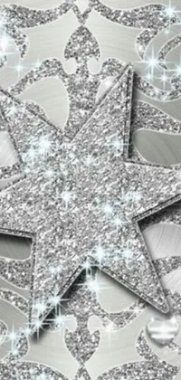 Looking for a stunning winter-themed live wallpaper for your phone? This silver snowflake with a star on it is the perfect addition to your screen