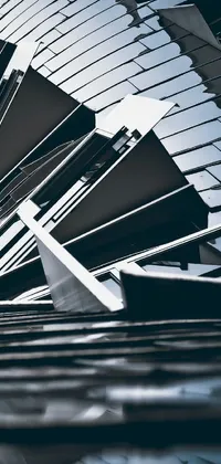 This live phone wallpaper features a stunning black and white photo of a futuristic building with an abstract sculpture