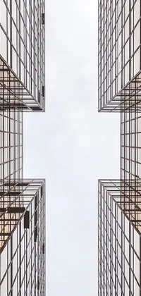 This phone live wallpaper showcases two tall Bauhaus-style buildings standing next to each other, as captured in a stunning stock by a professional photographer