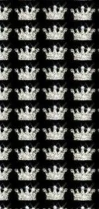 This phone live wallpaper features a stylish black and white pattern with a striking crown design