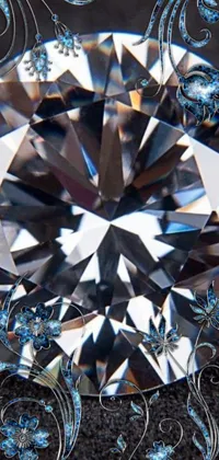 This phone live wallpaper showcases a striking blue diamond sitting on a sleek black surface in a kaleidoscope effect