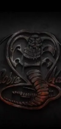This live phone wallpaper features a close-up image of a cobra on a dark black background