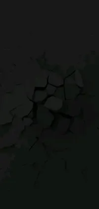 This live phone wallpaper features a digital art scene of a mobile phone resting on a cracked wall, set against a solid black background