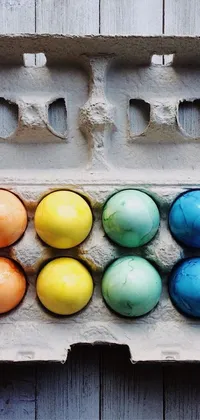 Decorate your phone with this stunning live wallpaper of a carton of Easter eggs on a wooden table