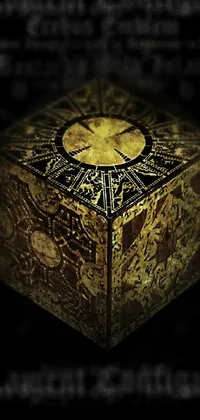 This phone live wallpaper features a golden clock and a wooden box with mythological creatures in the backdrop