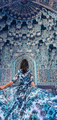 Enjoy this mesmerizing phone live wallpaper featuring an elegant woman standing in front of a gorgeous blue and white building, decorated with intricate psychedelic patterns and an arabesque style