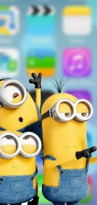 Experience the cuteness overload with this amazing phone live wallpaper! Featuring two adorable minions standing together in their signature blue overalls and goggles, this wallpaper will bring a smile to your face every time you open your iOS device