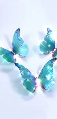 Experience the magical beauty of this stunning live wallpaper for your phone! It features a group of delightful blue butterflies sitting on a pristine white surface with iridescent accents that add a touch of enchantment to your screen