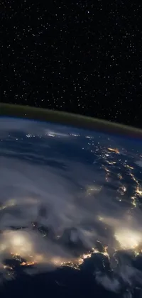 Download this stunning live phone wallpaper showing Earth at night viewed from outer space