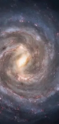 This live phone wallpaper showcases a mesmerizing spiral galaxy with a black hole at its center and the Milky Way galaxy peeking from above